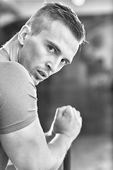 Image showing man workout with hammer and tractor tire