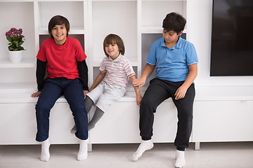 Image showing young boys posing on a shelf