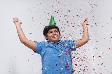 Image showing kid blowing confetti