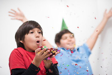 Image showing kids  blowing confetti