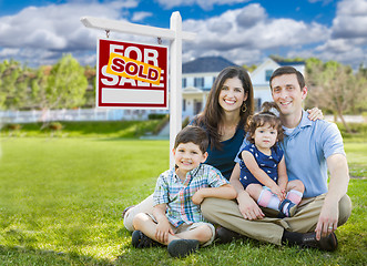 Image showing Young Family With Children In Front of Custom Home and Sold For 