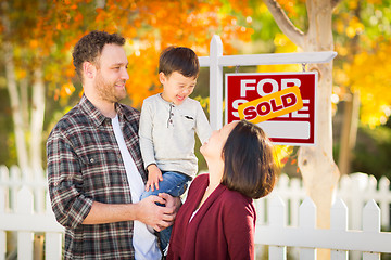 Image showing Young Mixed Race Chinese and Caucasian Family In Front of Sold F