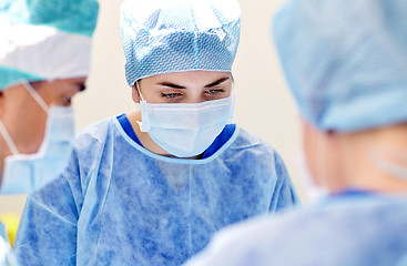 Image showing group of surgeons in operating room at hospital