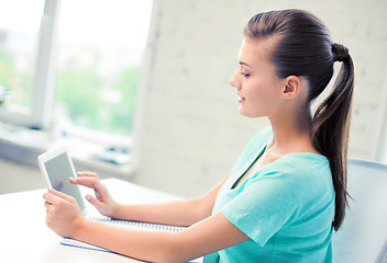 Image showing attractive student girl using tablet pc