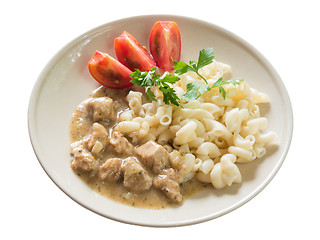 Image showing Pork goulash with macaroni and sliced tomato, isolated on white background