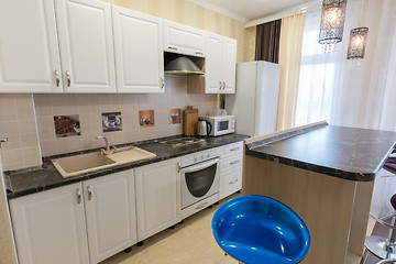 Image showing Interior of a one-room apartment, view of a kitchen set