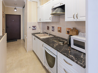 Image showing Interior of a one-room apartment, view from the kitchen to the entrance door