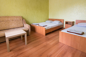 Image showing Interior of the room of a budget hotel with two beds