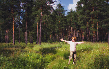 Image showing Man Raised Arms in Summer Forest