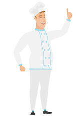 Image showing Caucasian chef cook pointing with his forefinger.