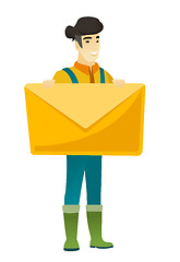 Image showing Smiling farmer holding a big envelope.