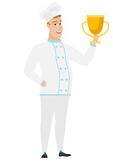 Image showing Caucasian chef cook holding a trophy.