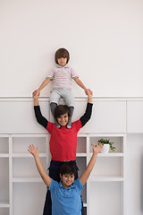 Image showing young boys posing line up piggyback