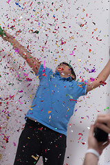 Image showing kid blowing confetti