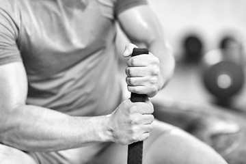 Image showing young man after workout with hammer and tractor tire