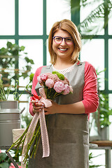 Image showing Florist with bouquet in shop