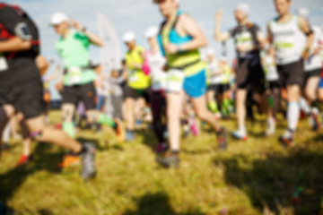 Image showing Sportsmen running on green grass