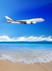 Image showing beach and blue sky with plane 