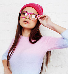 Image showing young happy smiling mulatto latin american teenage girl emotional posing on white background, lifestyle people concept