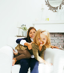 Image showing two cute sisters at home playing, little girl in house interior 