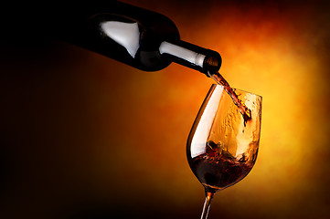 Image showing Wineglass on orange background