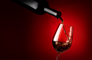Image showing Wineglass on a red background