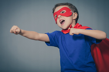 Image showing Happy little child playing superhero.