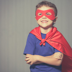 Image showing Happy little child playing superhero.