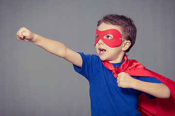 Image showing Happy little child playing superhero.