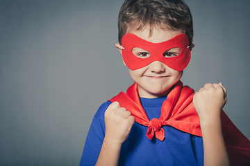 Image showing Happy little child playing superhero.