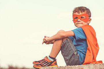 Image showing Happy little child playing superhero.