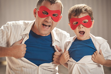 Image showing Father and son playing superhero outdoors at the day time.