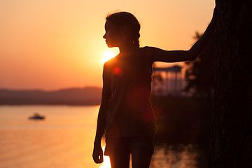 Image showing Portrait of sad little girl standing on the beach