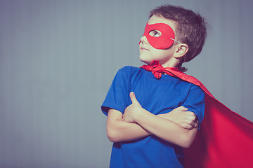 Image showing Happy little child playing superhero.