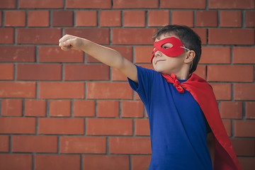 Image showing Happy little child playing superhero.