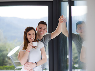 Image showing young couple enjoying morning coffee