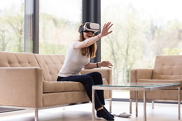 Image showing woman using VR-headset glasses of virtual reality