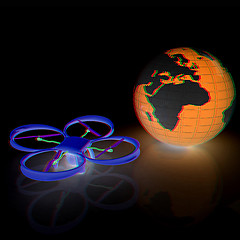 Image showing Quadrocopter Drone with Earth Globe and remote controller on a w