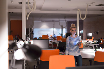 Image showing woman working on digital tablet in night office