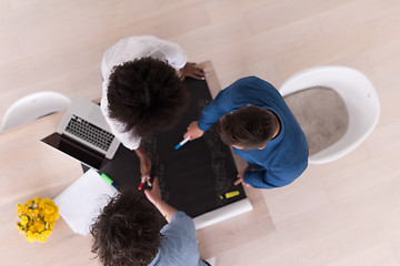 Image showing top view of Multiethnic startup business team on meeting