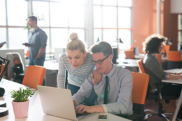 Image showing Two Business People Working With laptop in office