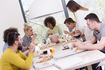 Image showing multiethnic group of happy friends lunch time