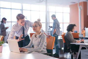 Image showing Two Business People Working With laptop in office