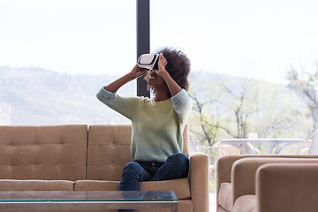 Image showing black woman using VR headset glasses of virtual reality