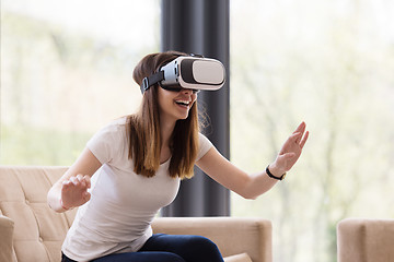 Image showing woman using VR-headset glasses of virtual reality