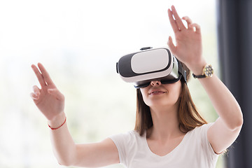 Image showing woman using VR-headset glasses of virtual reality