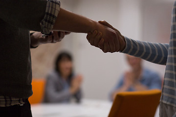 Image showing cloasing the deal in modern office interior