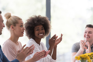 Image showing multiethnic startup Group of young business people celebrating s