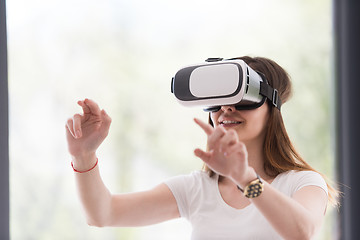 Image showing woman using VR-headset glasses of virtual reality