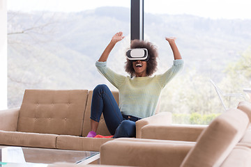 Image showing black woman using VR headset glasses of virtual reality